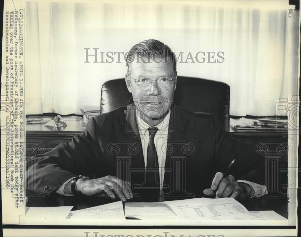 1968 International Bank President McNamara poses at desk - Historic Images