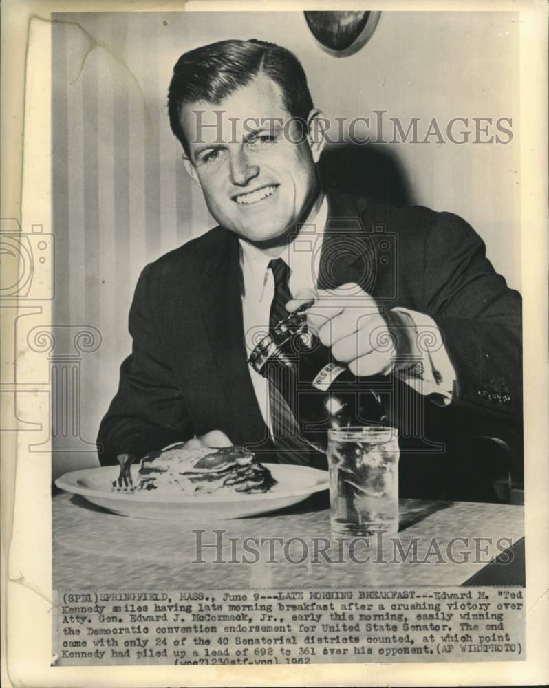 1962 Edward Kennedy smiles over late morning breakfast in MA - Historic Images