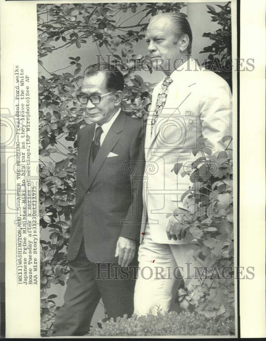 1975 President Ford walks Japan's Miki to waiting car at White House - Historic Images