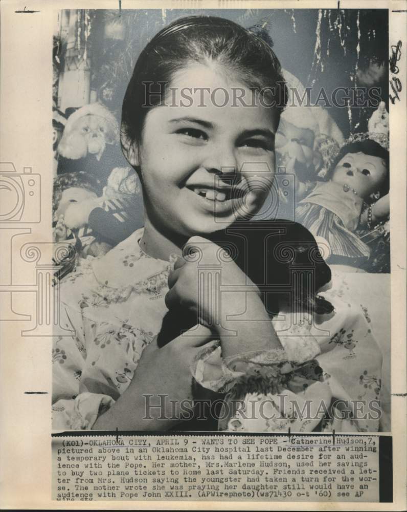 1959 Catherine Hudson shown in hospital holding a pet - Historic Images