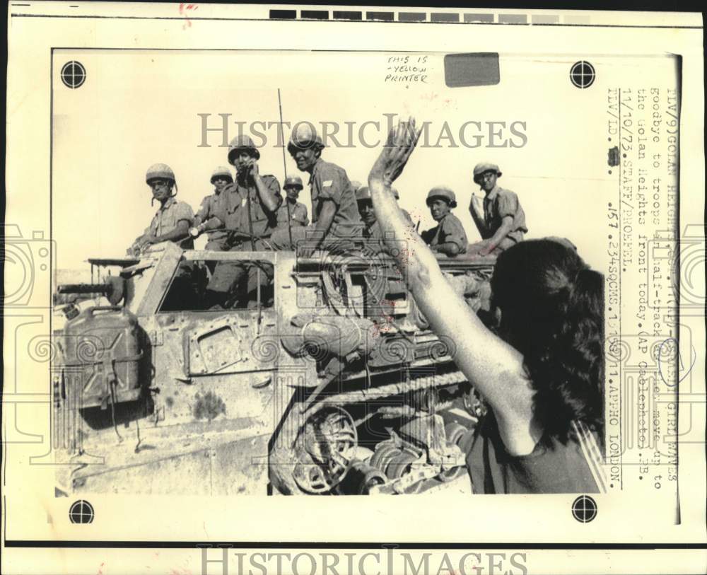 1973 Girl waves goodbye to troops on move to Golan Heights. - Historic Images