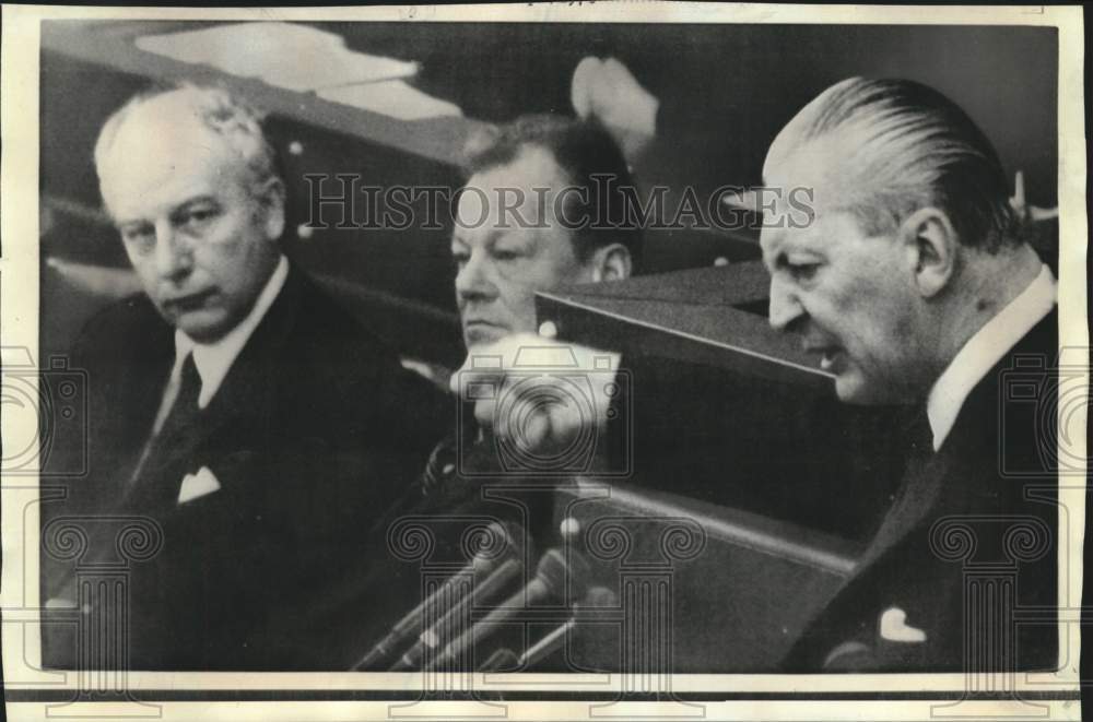 1970 Kurt-Georg Kiesinger gestures toward Willy Brandt in Bundestag - Historic Images