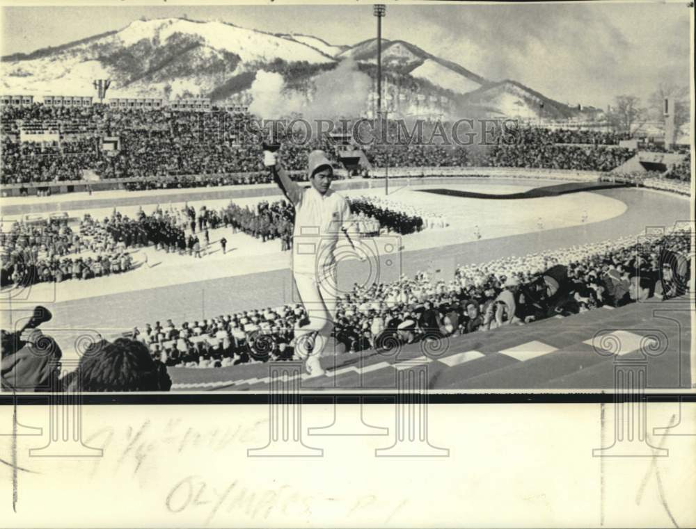 1972 Hideki Takada runs Makomanai Stadium steps to ignite flame - Historic Images