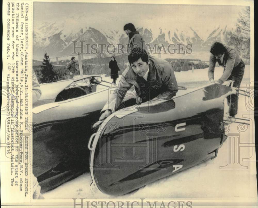 1976 Grant and Proctor clean bobsled runners at Innsbruck Olympics - Historic Images