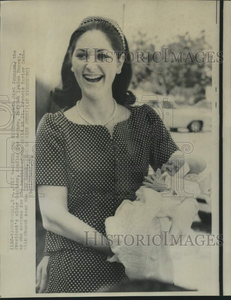 1967 Lynda Bird Johnson holds nephew Patrick Nugent in Texas - Historic Images