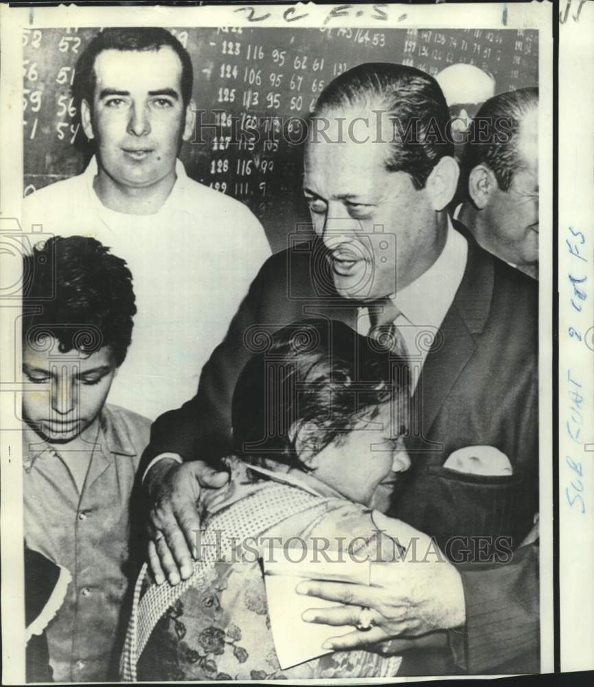 1970 Colonel Carlos Osorio comforts weeping admirer in Guatemala - Historic Images