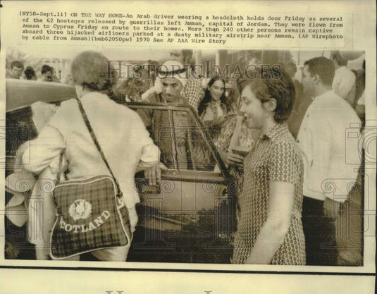1970 Press Photo An Arab driver holds the door open for airline hostages, Jordan-Historic Images