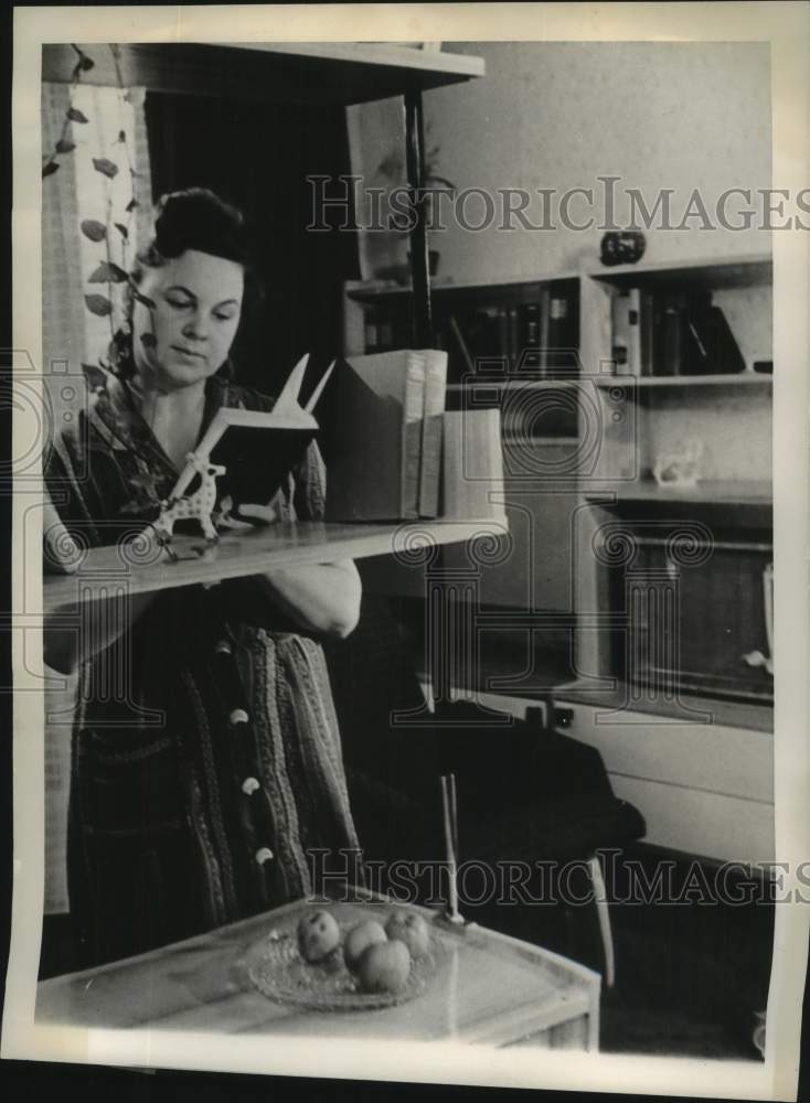 1963 Press Photo Russian Woman Reads in Two-Room Apartment, Soviet Union - Historic Images