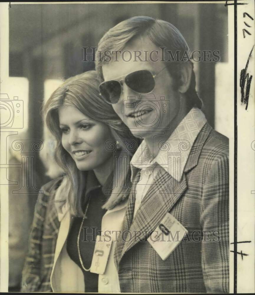 1974 Former Miss World Marjorie Wallace poses with Peter Revson - Historic Images