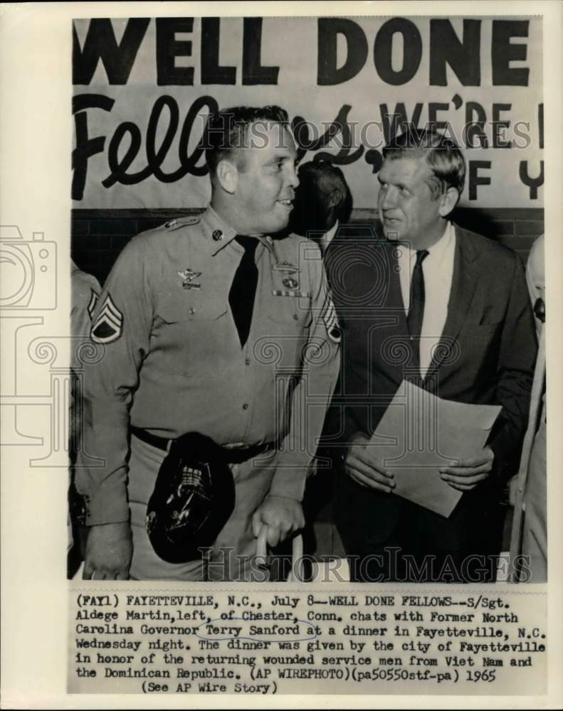 1965 Press Photo S/Sgt. Aldege Martin and Terry Sanford chat at honoring dinner - Historic Images