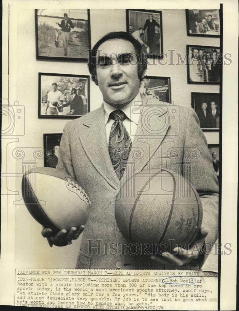 1974 Press Photo Sports attorney Bob Woolf holds football and basketball balls- Historic Images