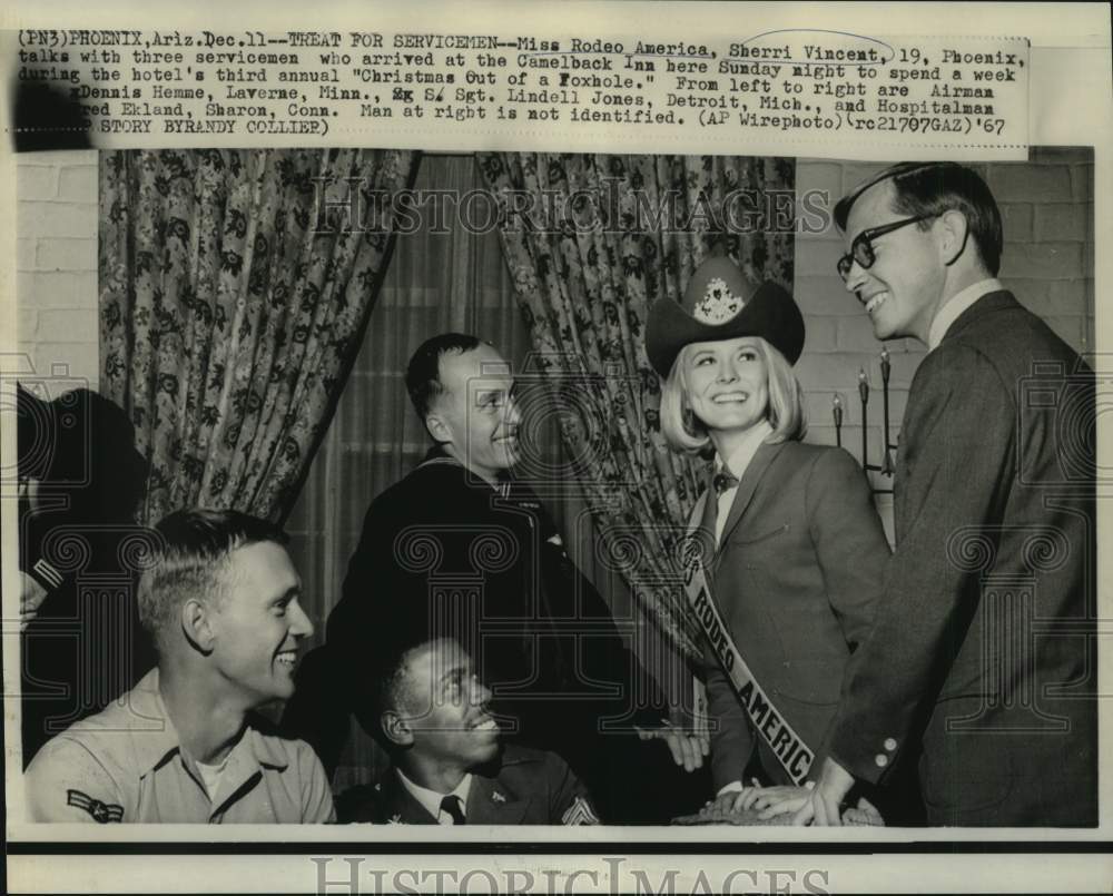 1967 Miss Rodeo Sherri Vincent with servicemen at Camelback Inn - Historic Images