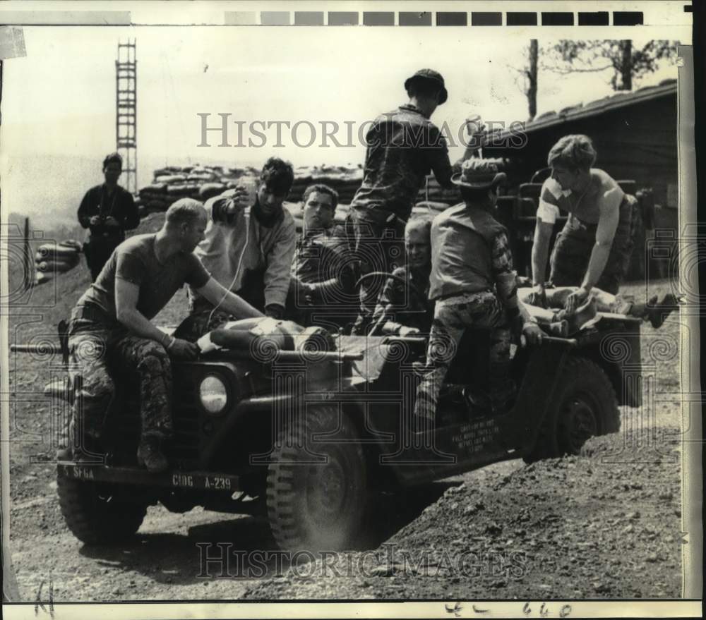 1969 Wounded U.S. soldiers evacuate after battle in Duc Lap Camp - Historic Images