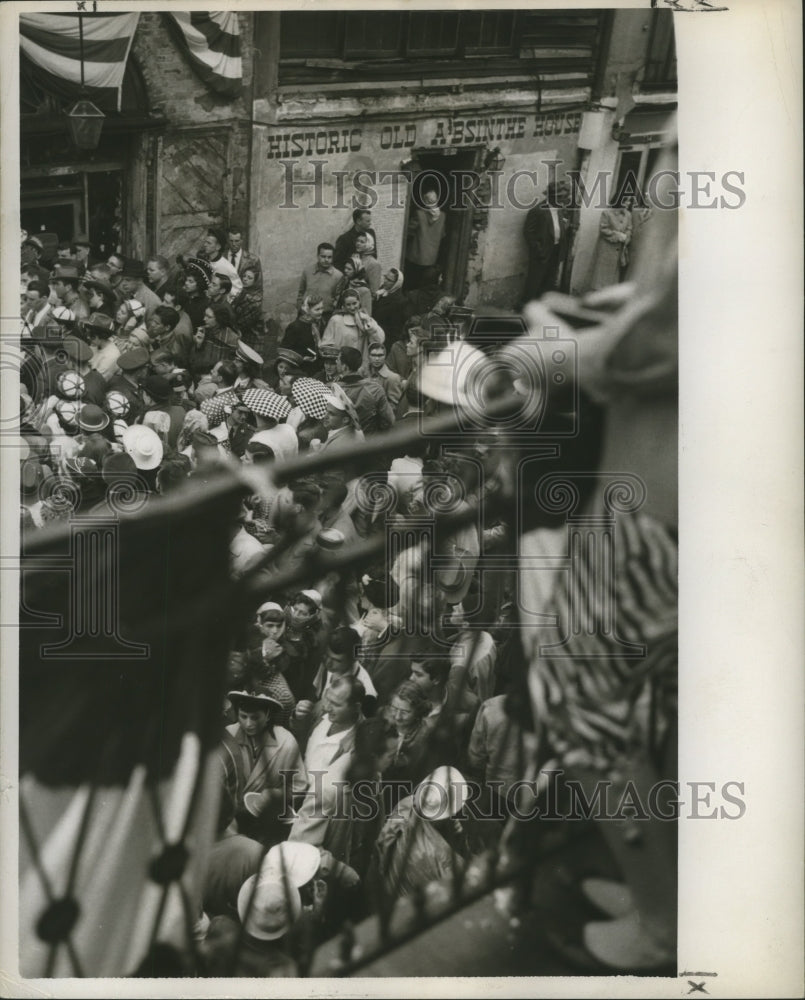 1956  New Orleans Mardi Gras Carnival crowd watching from Bourbon st-Historic Images