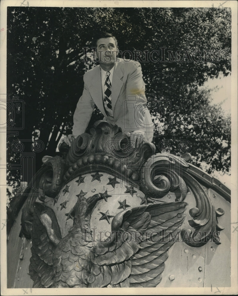 1947 Press Photo Correspondent Bill Minor poses on bow of first Battleship-Historic Images