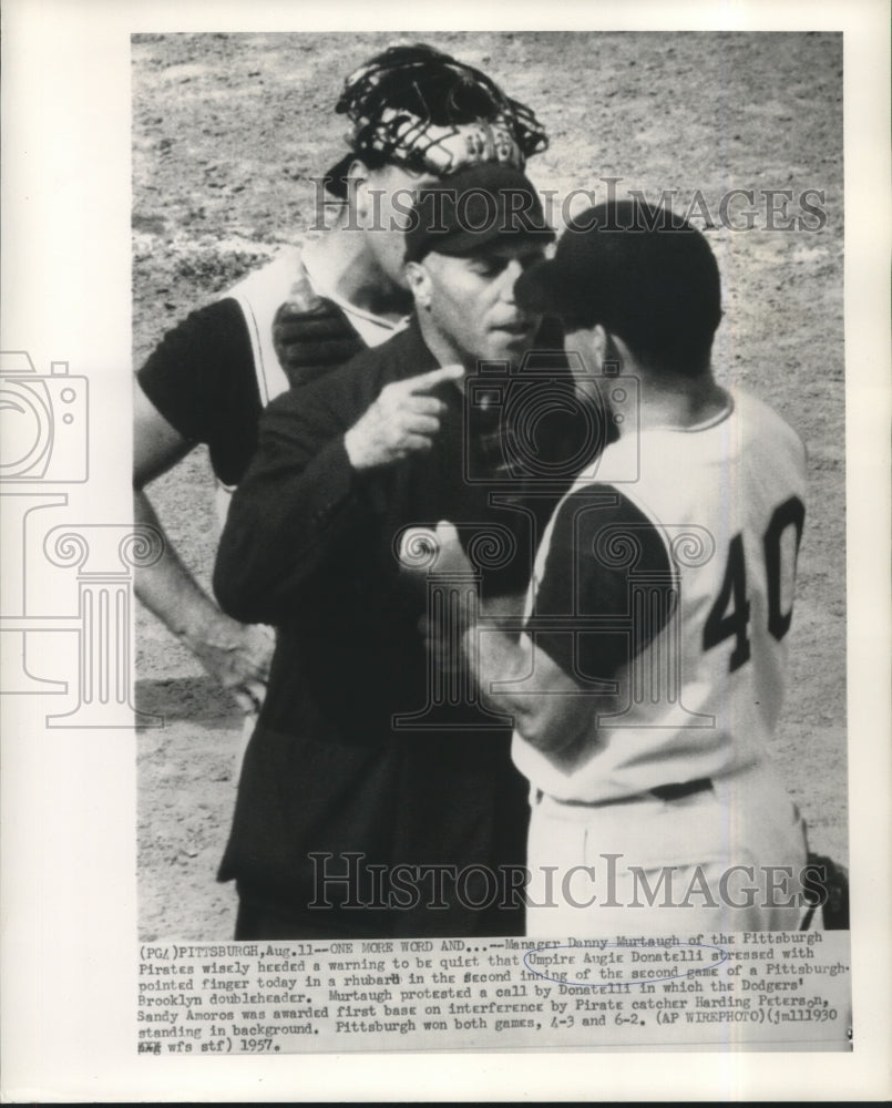 1957 Press Photo Umpire Augie Donatelli points a finger at Danny Murtaugh.- Historic Images