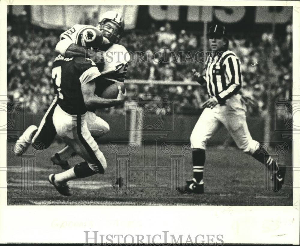 1979 Saints Football Player Elois Grooms and Joe Theismann in game - Historic Images