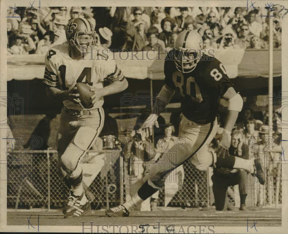 1971 Footballers Edd Harget (Saints), Art Thoms (Oakland) on Field - Historic Images