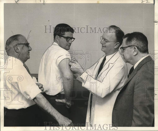 1957  P.E. Fischer receives polio vaccination from Dr. L.C. Eyrich-Historic Images