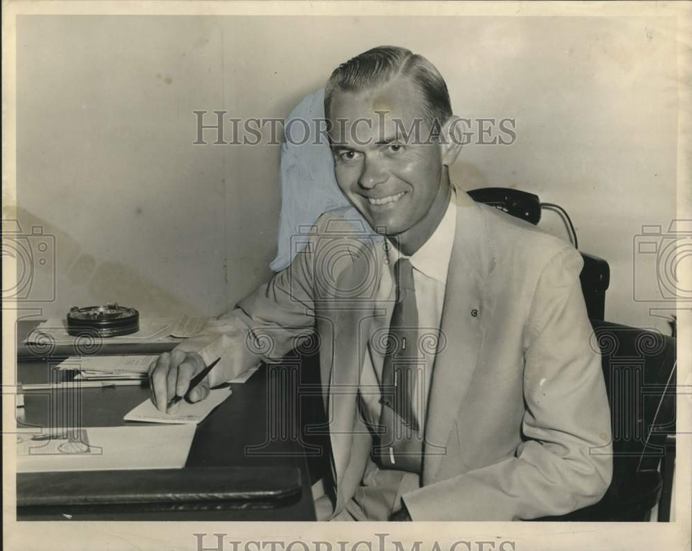 1955 Herman S. Jones Jr. at his desk in his office - Historic Images