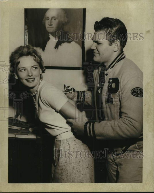 1958 Press Photo Jack McCain demonstrates his thieves hold on Sharon Brownlee.- Historic Images