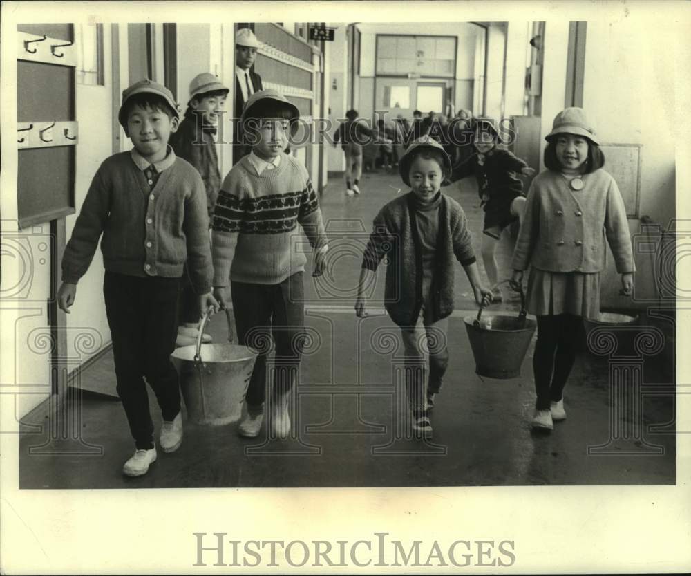 1968 Young Tokyo Students Take Buckets to Classrooms for Cleanup - Historic Images