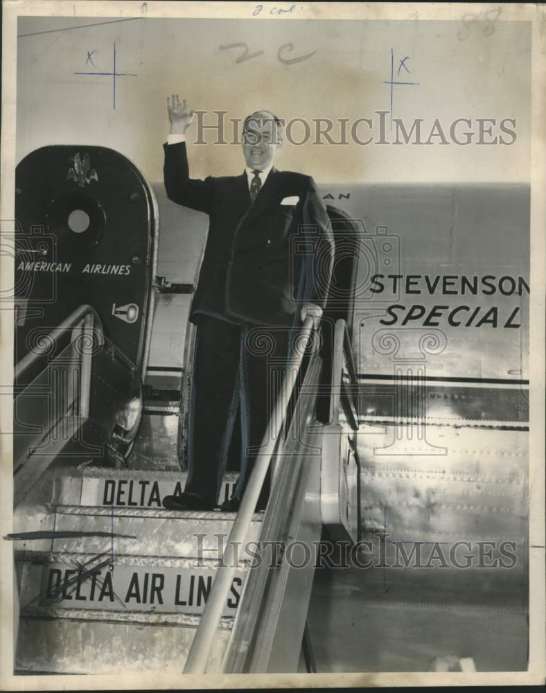 1952 Adlai E. Stevenson getting on a Delta airplane bound for Miami. - Historic Images