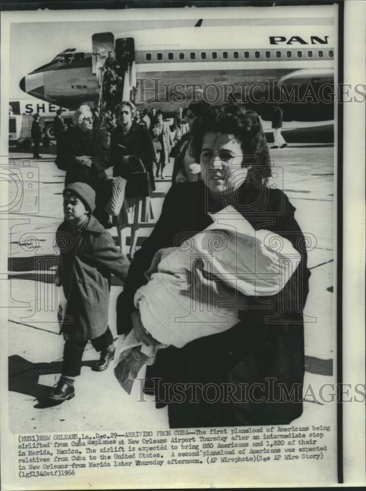 1966 Press Photo Americans and their relatives deplane at New Orleans Airport. - Historic Images