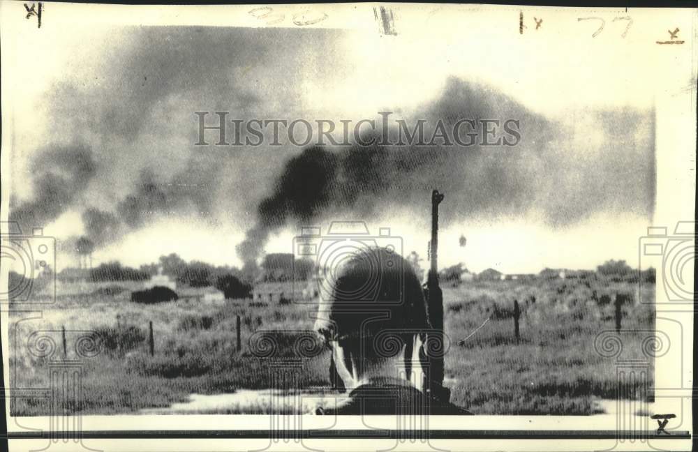 1972 Press Photo Vietnamese Soldier Watches Smoke Rise from Ammunition Dump - Historic Images