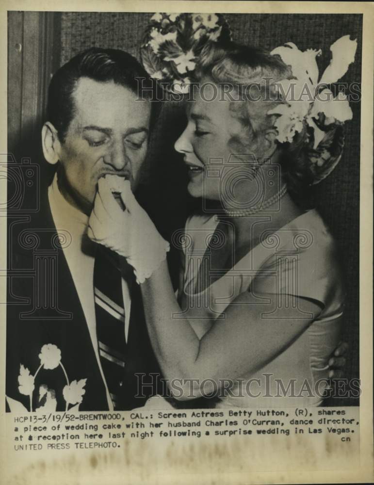 1952 Betty Hutton &amp; Charles O&#39;Curran share wedding cake in Las Vegas - Historic Images