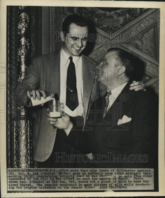 1946 Press Photo Senator Lee O'Daniel gets a glass of milk on Senate floor. - Historic Images