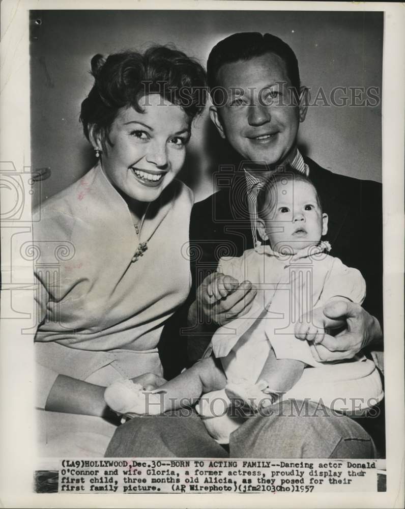 1957 Donald O'Connor and wife Gloria with their daughter Alicia. - Historic Images