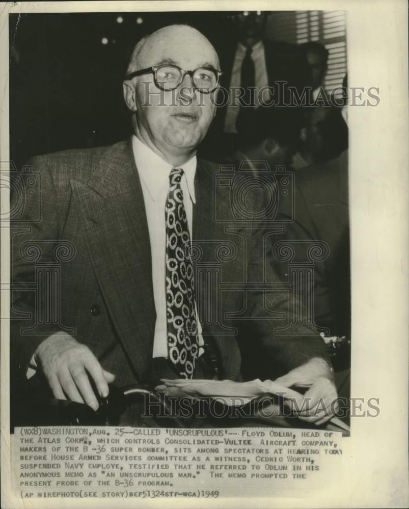 1949 Floyd Odlum watches Cedric Worth testify at the hearing. - Historic Images