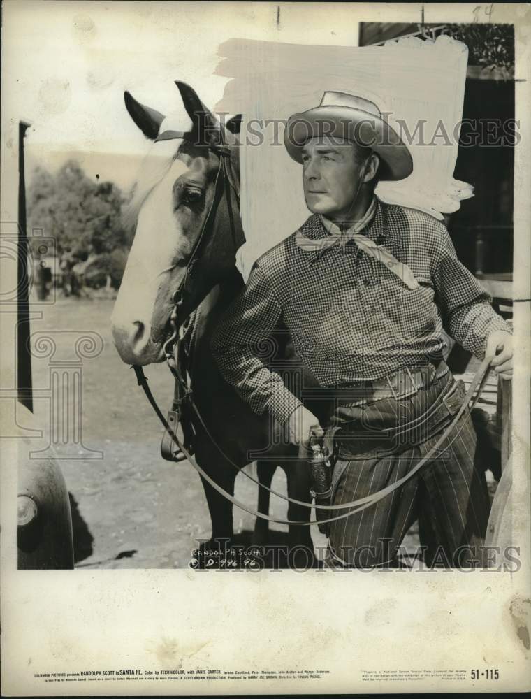 1951 Press Photo Actor Randolph Scott &amp; his horse in a scene from &quot;Santa Fe&quot; - Historic Images