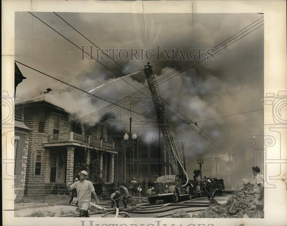 1956 Press Photo New Orleans firemen fight Camp Street blaze. - nox60996- Historic Images