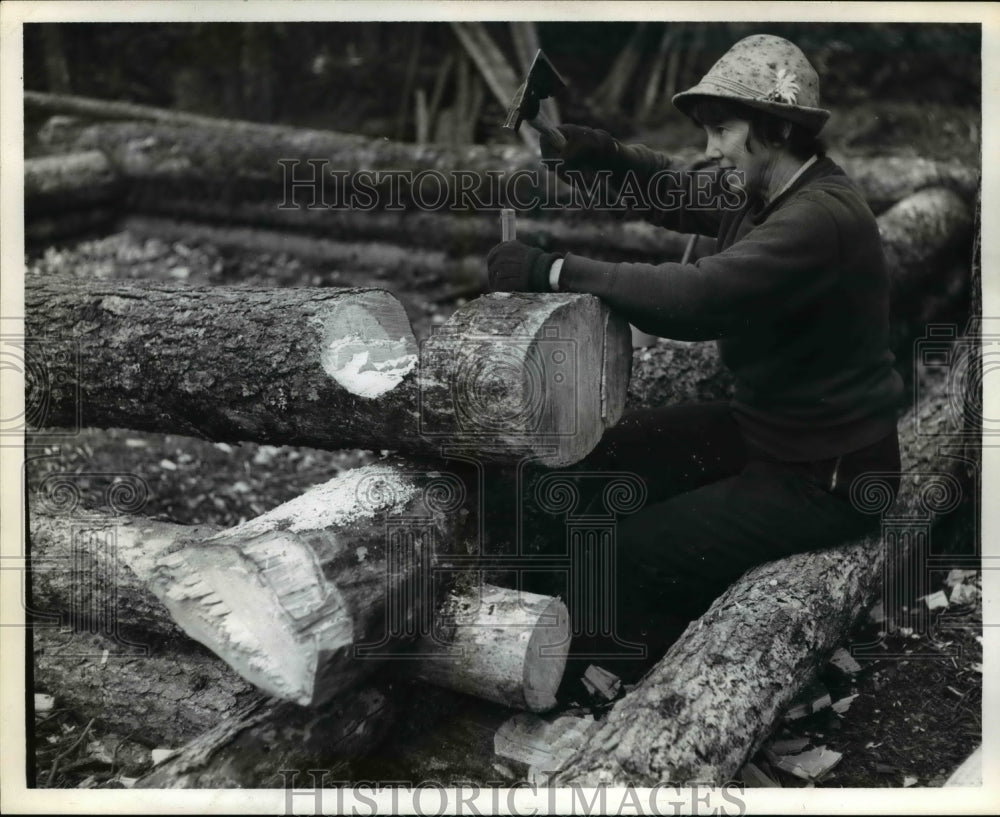 Woman cuts Tree Logs  - Historic Images