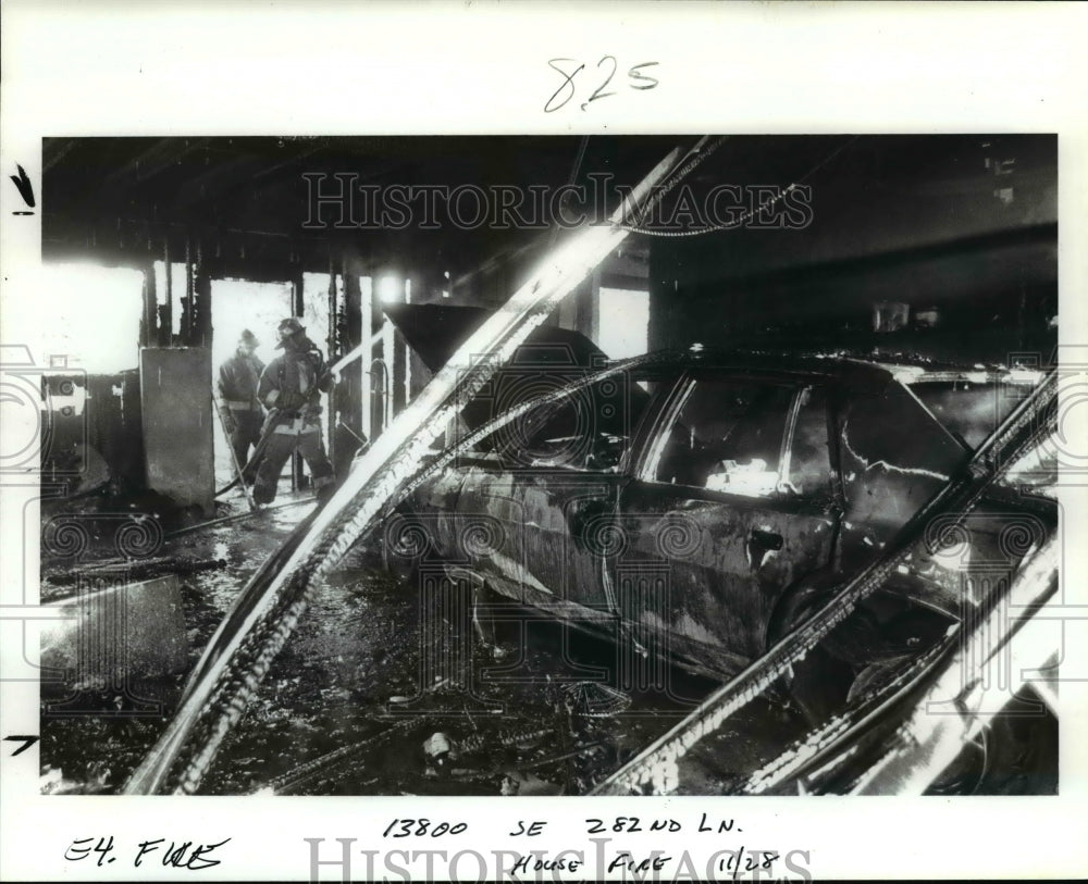 1989 Press Photo Firefighters spray the wreckage-burned car-Portland - orb69524- Historic Images