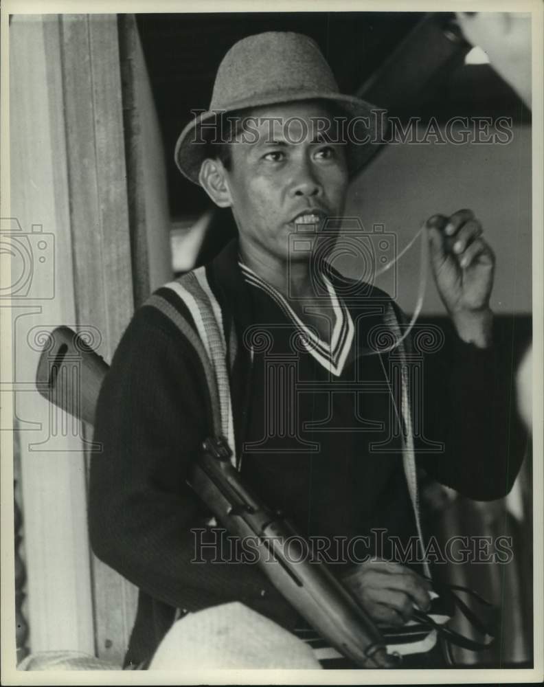 1969 Man in hat carrying shot gun, Philippines-Historic Images