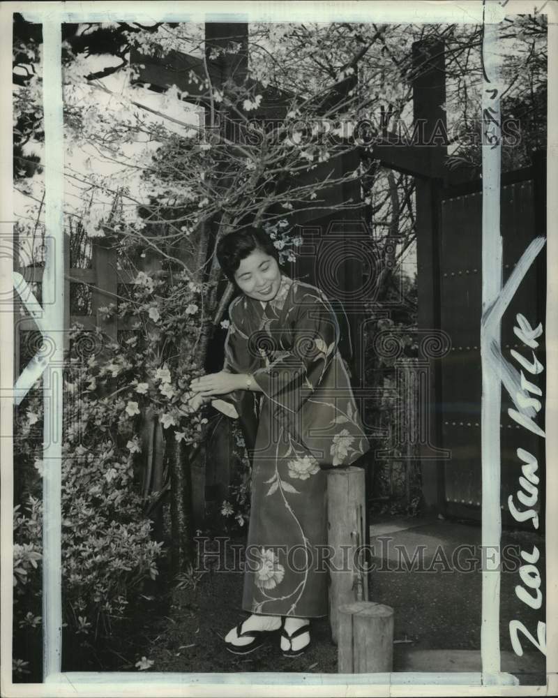 1959 Sayoko Lombard holds flowers in Golden Gate Park, San Francisco-Historic Images