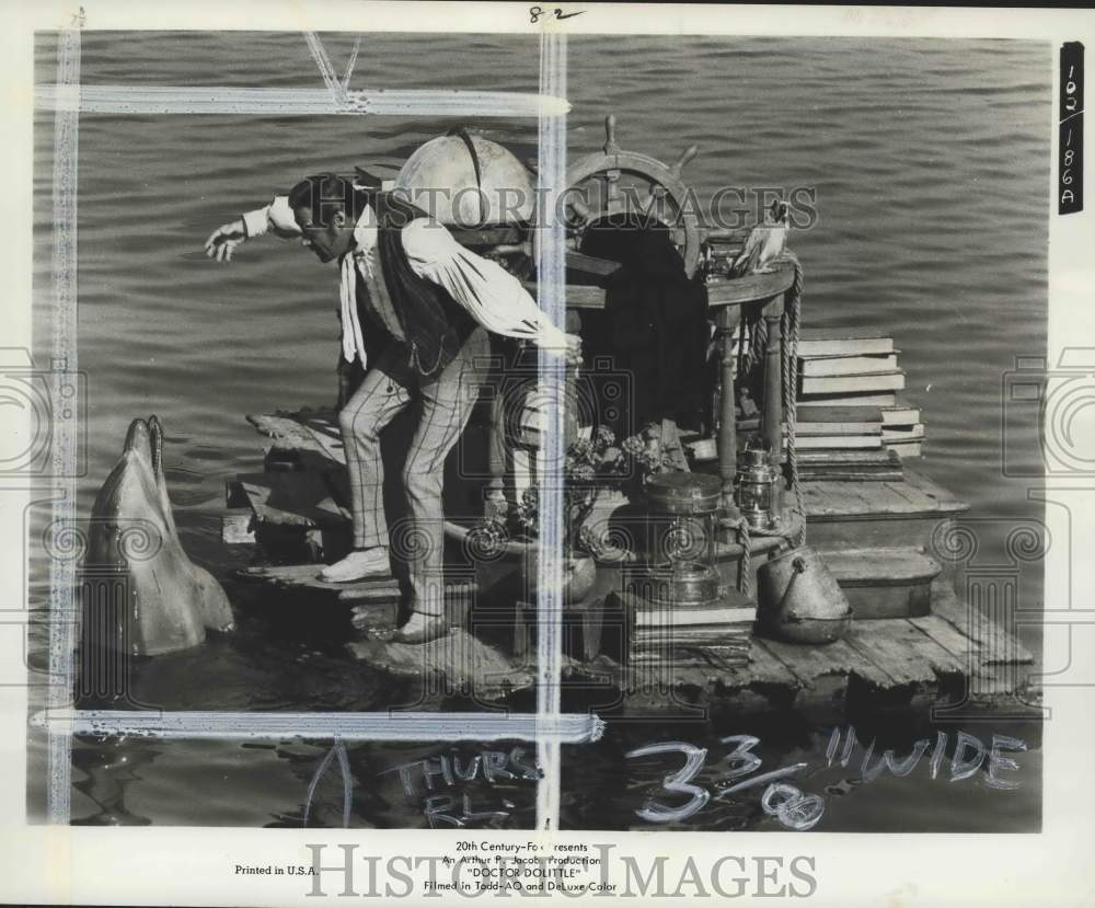 1968 Actor Rex Harrison talks to a Dolphin in "Doctor Dolittle"-Historic Images