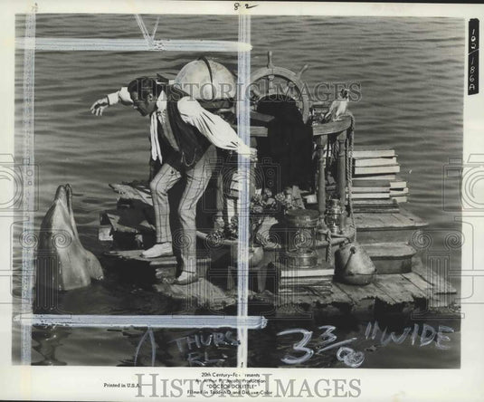1968 Actor Rex Harrison talks to a Dolphin in "Doctor Dolittle"-Historic Images