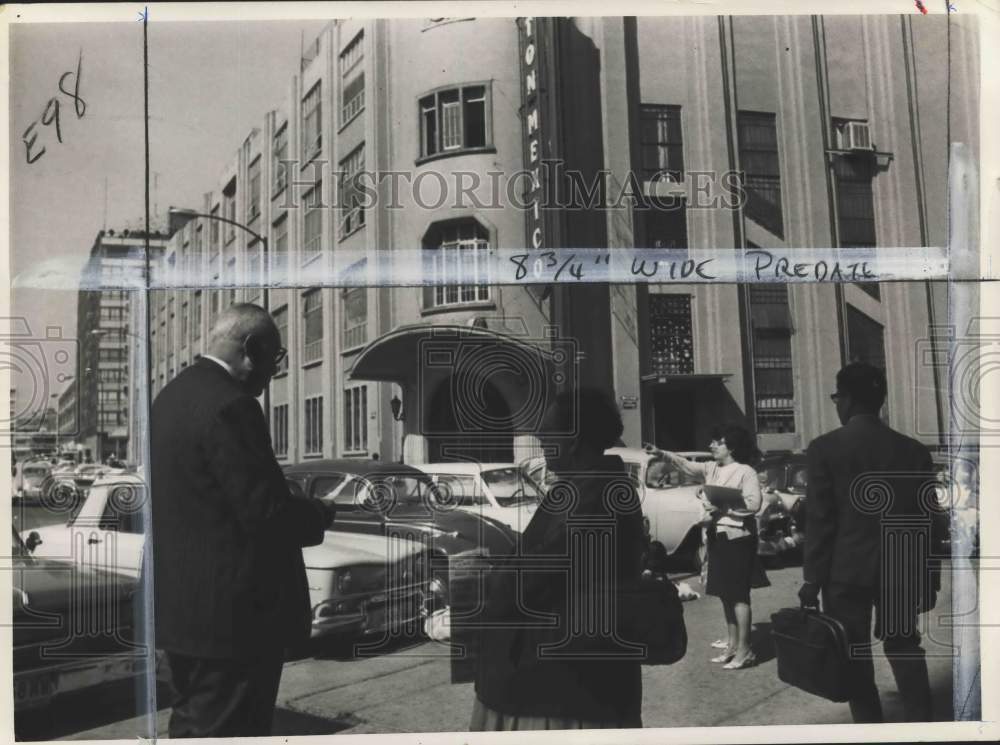 1969 Man with briefcase & others stand by parked cars in Mexico-Historic Images