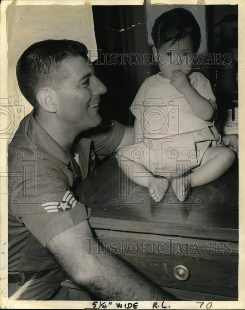 1968 Air Force Sgt. Robert Peck and child, Phu My orphanage, Vietnam-Historic Images