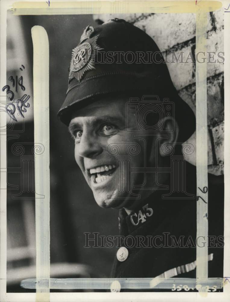 1966 British comedian Norman Wisdom wears police costume-Historic Images