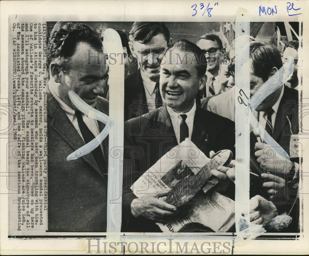 1968 Sam Jaffe & George Wallace holding a sandal, Atlanta, Georgia-Historic Images