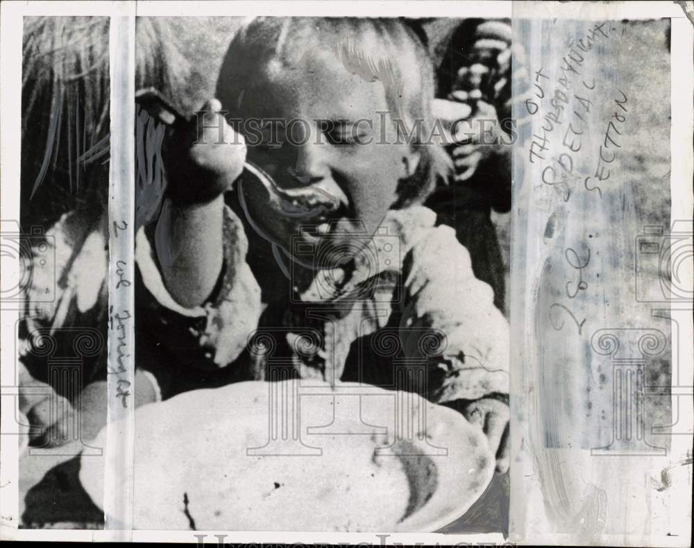 1947 Press Photo Child eating a plate of food - pio42957- Historic Images