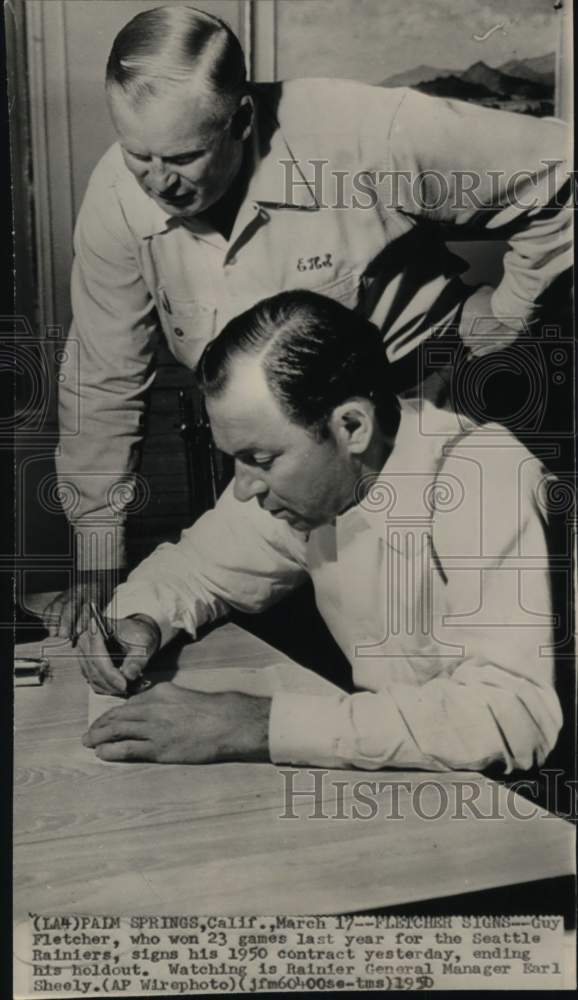 1950 Press Photo Guy Fletcher sign with Rainiers baseball team, Palm Springs, CA- Historic Images