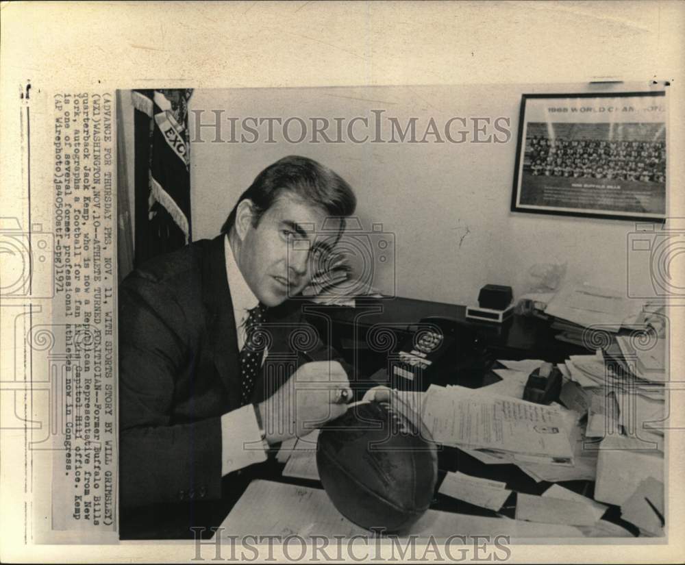 1971 Press Photo Congressman Jack Kemp signs football for fan in Washington DC - Historic Images