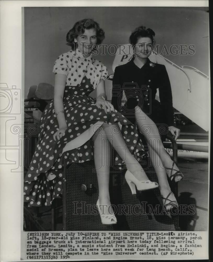 1954 Lenita Airiste & Regina Ernst on baggage at airport in New York-Historic Images