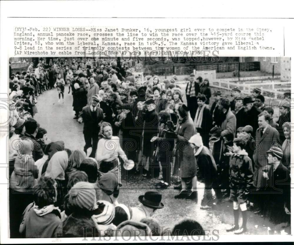 1966 Press Photo Janet Bunker crosses Pancake Race finish line in Olney, England - Historic Images